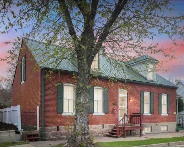 view of back house at dusk