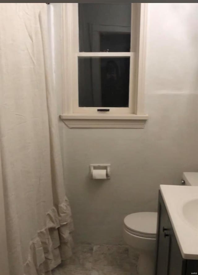 bathroom featuring vanity and toilet