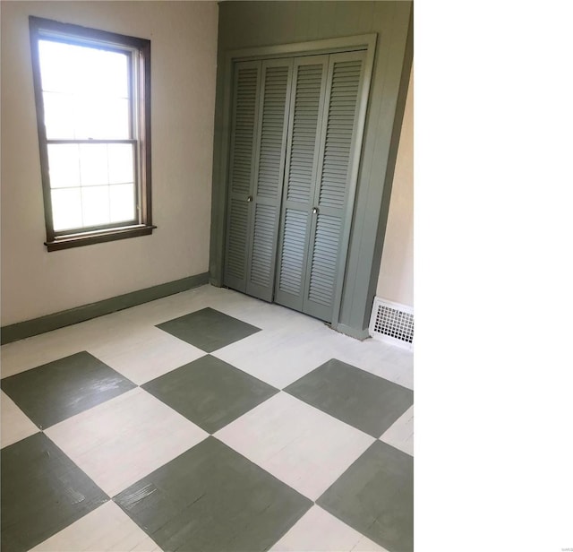 unfurnished bedroom featuring a closet