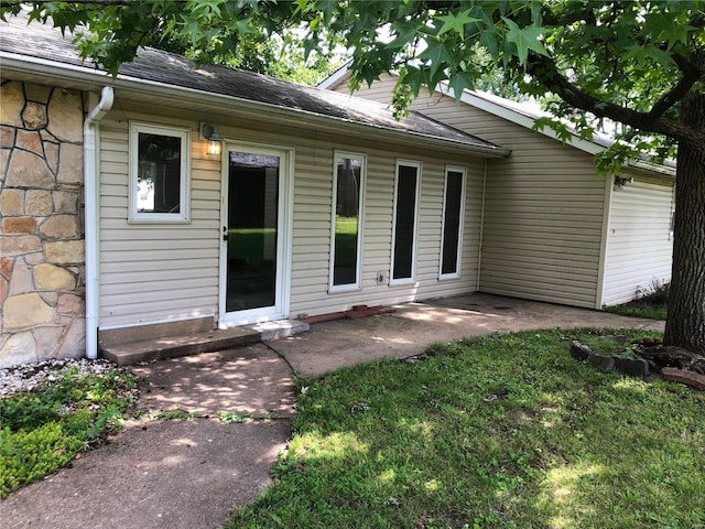 exterior space featuring a lawn and a patio