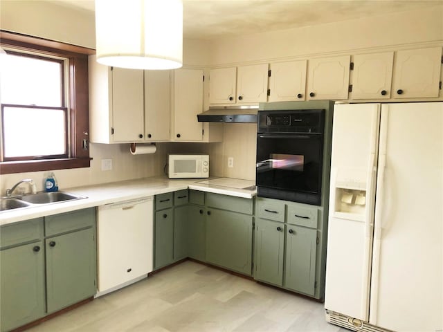 kitchen with sink, white cabinets, and white appliances