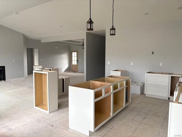 kitchen featuring a kitchen island and decorative light fixtures