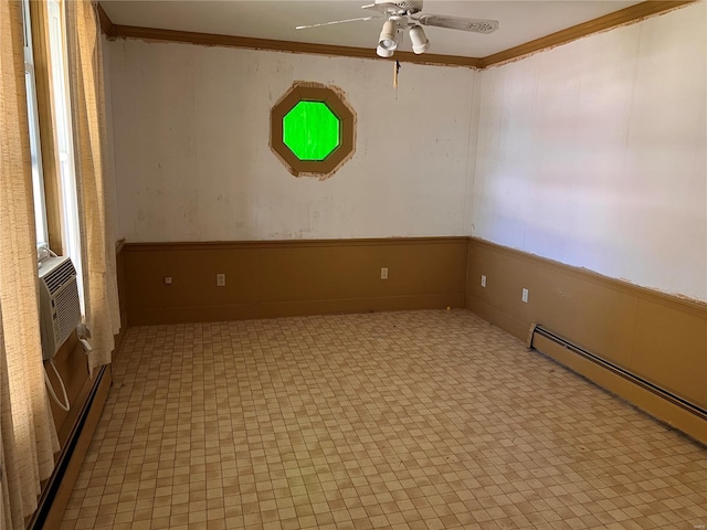 empty room featuring ceiling fan, ornamental molding, and light tile floors