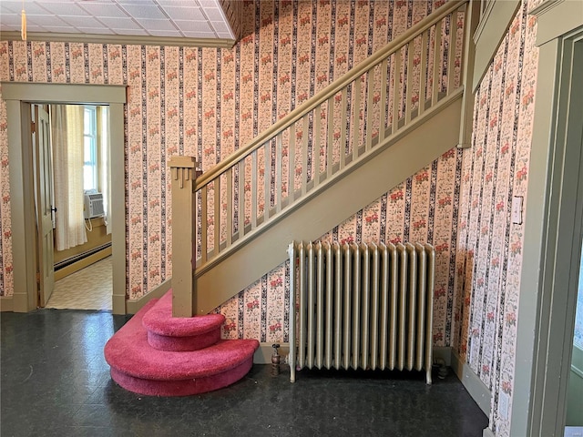 interior space with a baseboard radiator, dark tile floors, and radiator heating unit