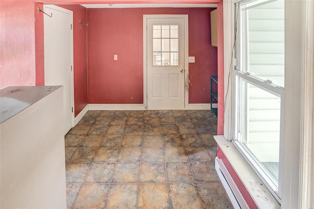 tiled foyer entrance with a healthy amount of sunlight