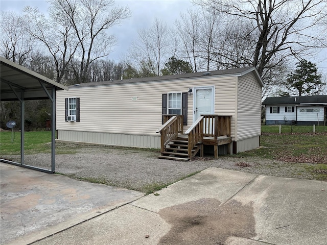 manufactured / mobile home featuring a carport