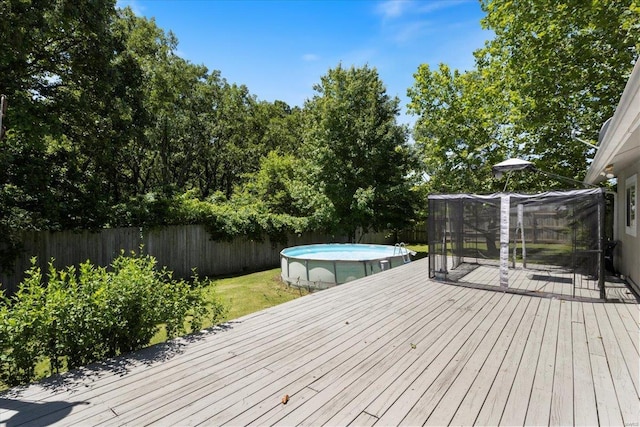 deck featuring a fenced in pool