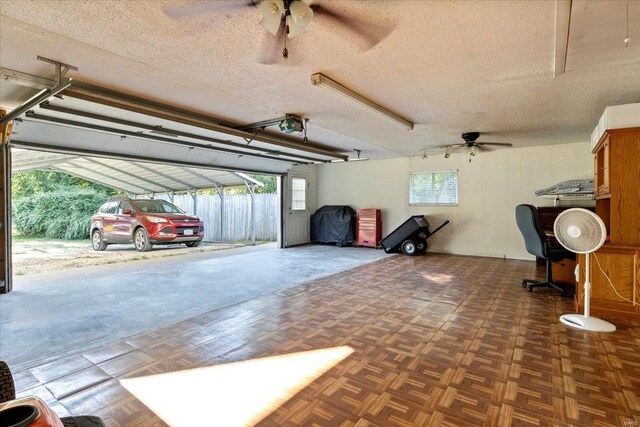 garage featuring ceiling fan and a garage door opener