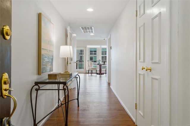 hall with wood-type flooring