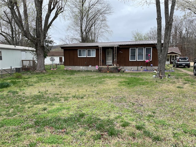 ranch-style home with a front lawn