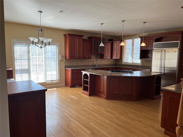 kitchen featuring a chandelier, plenty of natural light, and appliances with stainless steel finishes