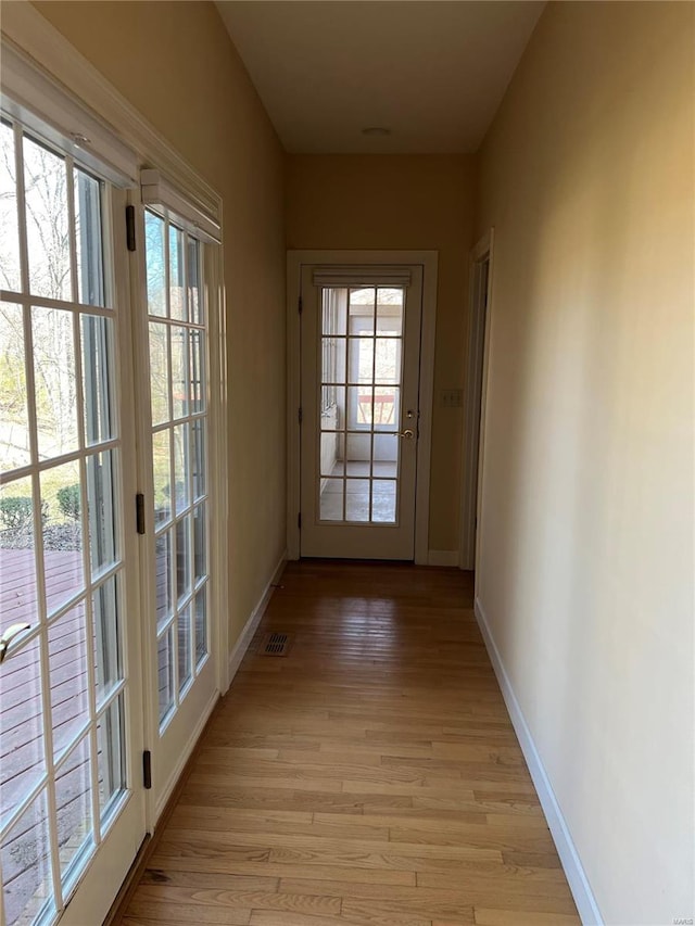 hall featuring light hardwood / wood-style flooring