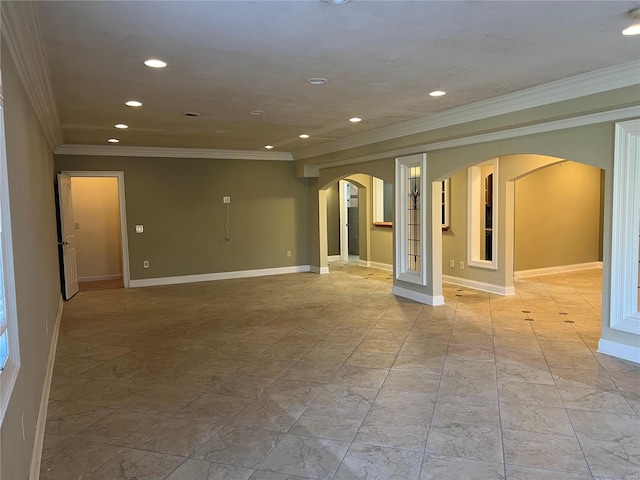 spare room with ornamental molding and light tile floors