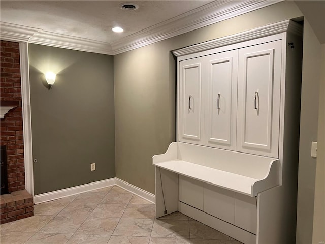 mudroom featuring light tile floors and ornamental molding