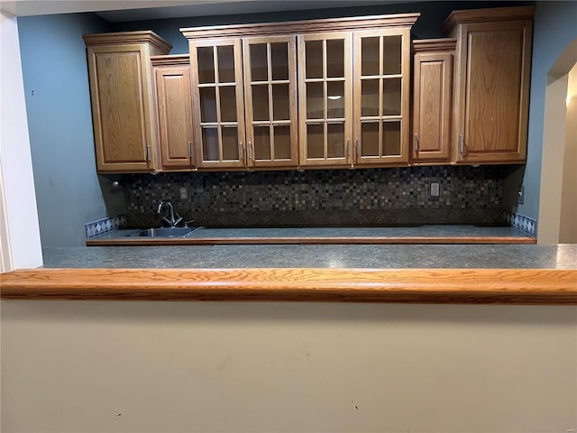 kitchen featuring sink and tasteful backsplash