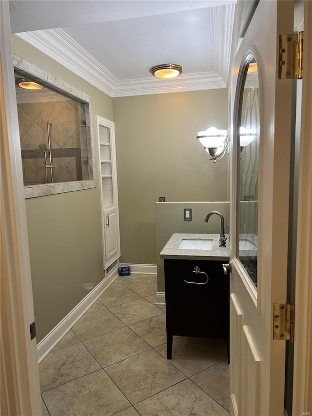 bathroom featuring vanity, tile floors, and crown molding