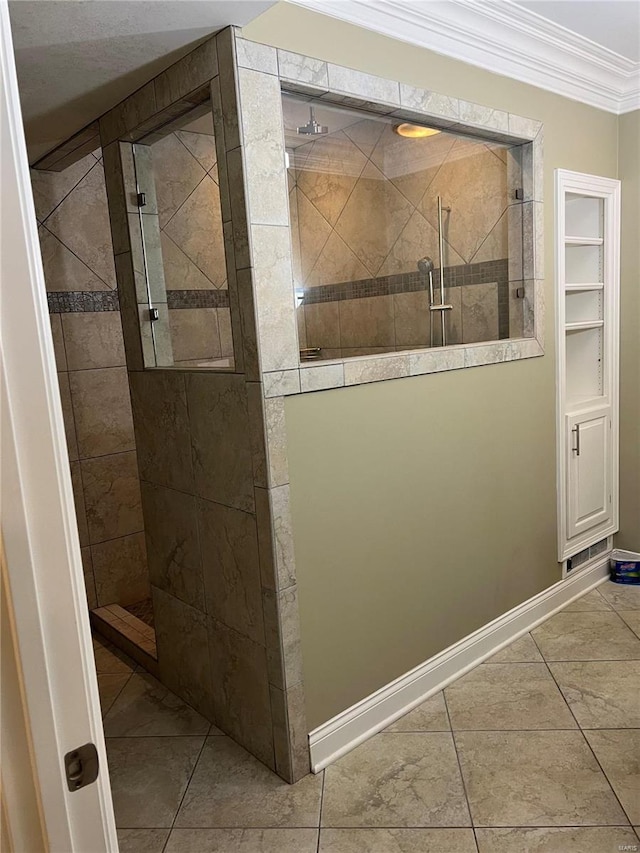 bathroom with ornamental molding, tiled shower, and tile floors