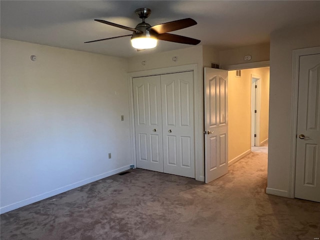 unfurnished bedroom featuring a closet, ceiling fan, and dark carpet