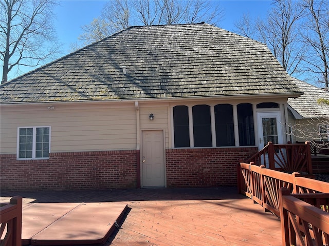 back of house with a wooden deck