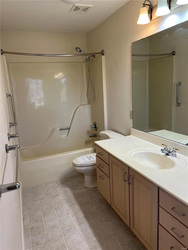 full bathroom with tile flooring, toilet, vanity, and shower / bath combination