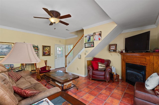 living room with crown molding, ceiling fan, and tile patterned floors