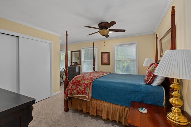 bedroom with crown molding, multiple windows, ceiling fan, and carpet flooring