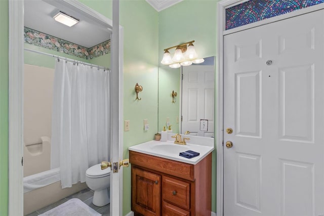 bathroom with crown molding, vanity, and toilet