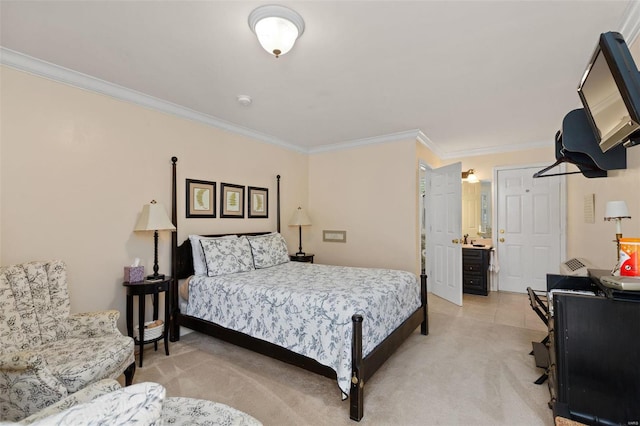 bedroom featuring light carpet, crown molding, and ensuite bathroom