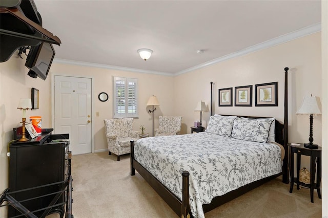 bedroom featuring carpet flooring and crown molding