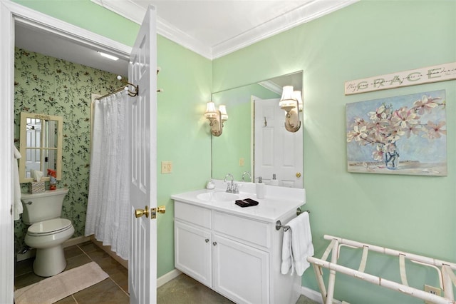 bathroom with tile patterned flooring, toilet, crown molding, and vanity