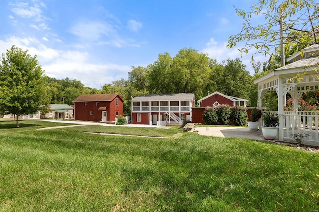 view of yard featuring an outdoor structure and a patio