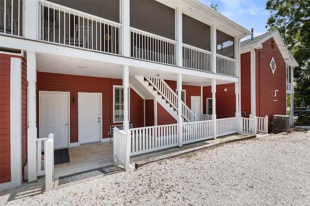 exterior space with covered porch and central air condition unit