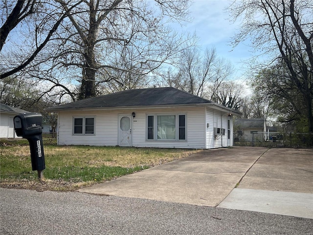 ranch-style home with a front lawn