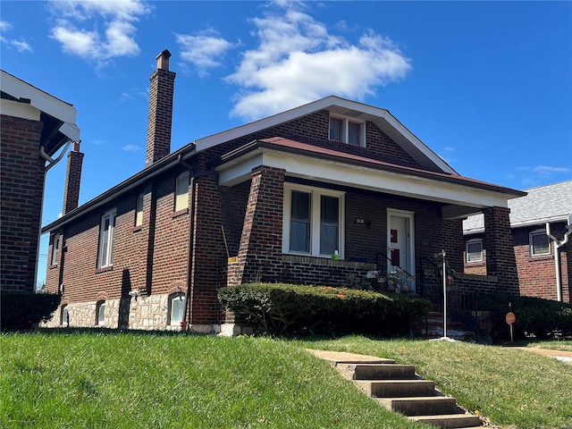 view of front of house with covered porch and a front yard