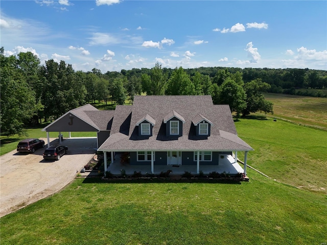 cape cod home featuring covered porch, a carport, and a front yard