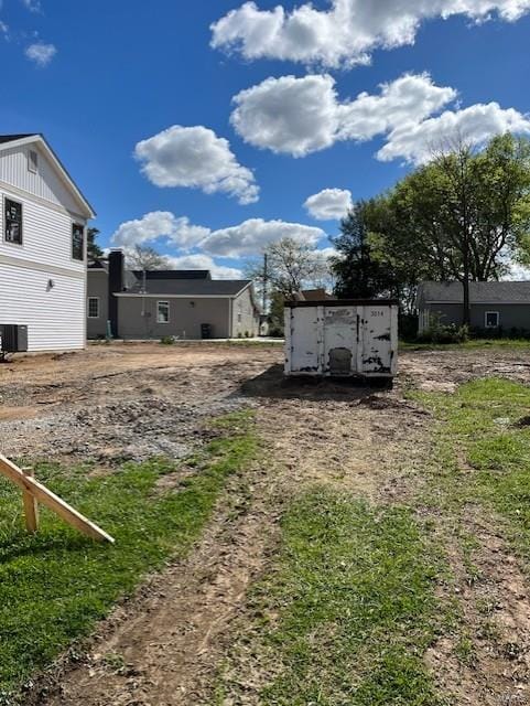 view of yard featuring central air condition unit