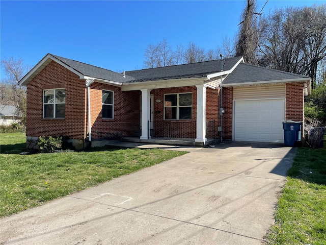 ranch-style home with a front lawn and a garage