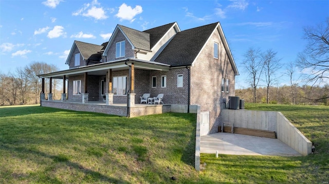 view of home's exterior featuring covered porch and a yard