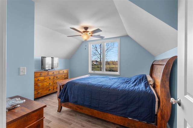 bedroom with lofted ceiling, ceiling fan, and light hardwood / wood-style flooring