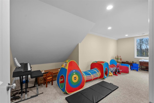 game room with light carpet and vaulted ceiling