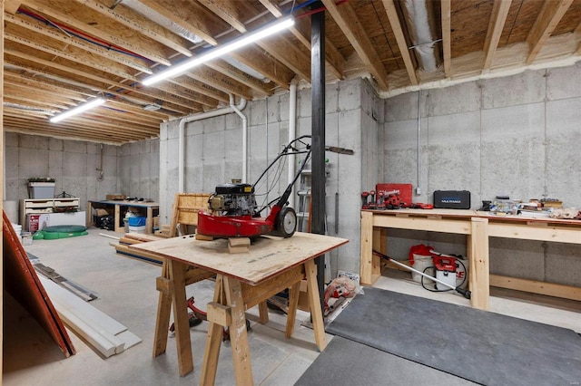 basement with a workshop area