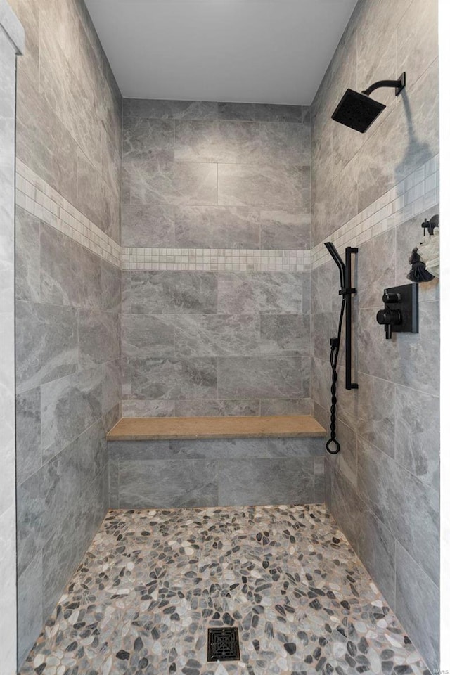 bathroom with a tile shower