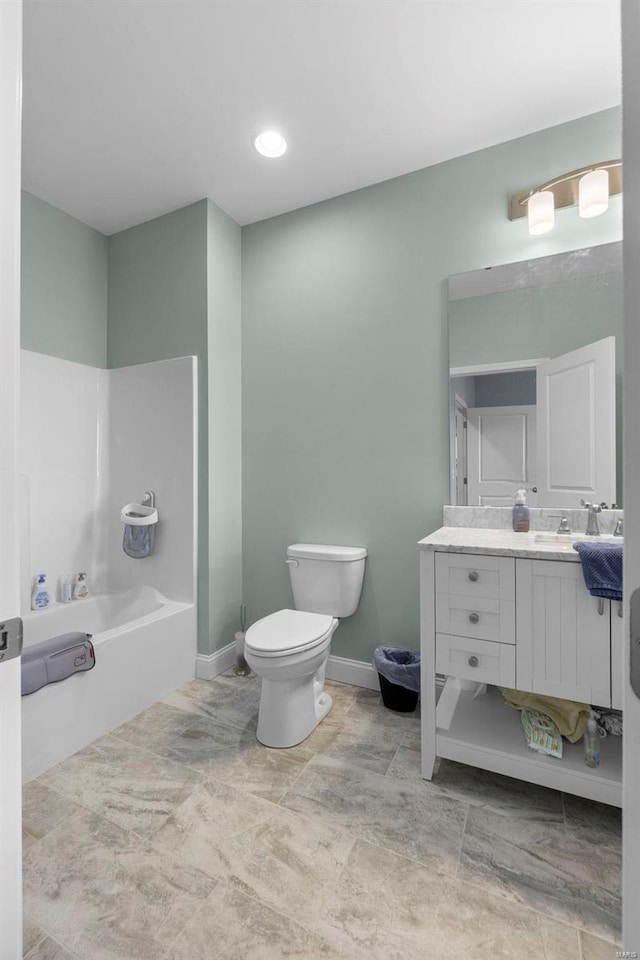 bathroom featuring tile floors, oversized vanity, and toilet