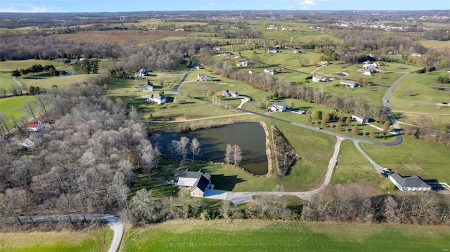 birds eye view of property featuring a rural view and a water view