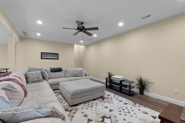 living room featuring light hardwood / wood-style floors and ceiling fan