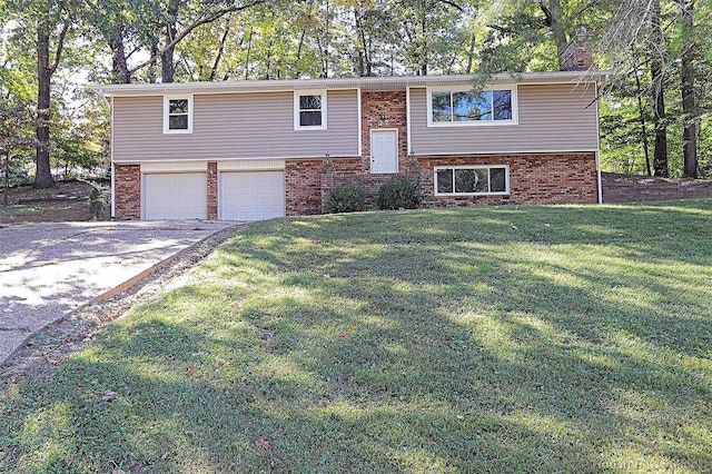 split foyer home with a front lawn and a garage