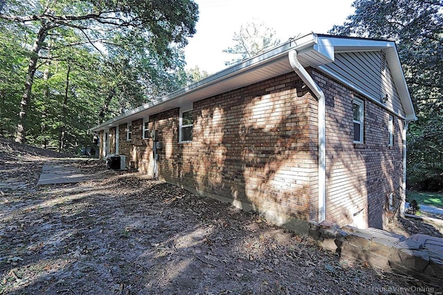 view of side of property featuring cooling unit