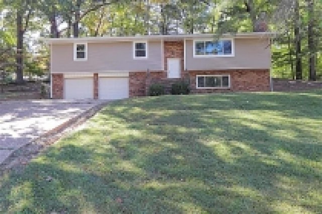 split foyer home with a front lawn and a garage