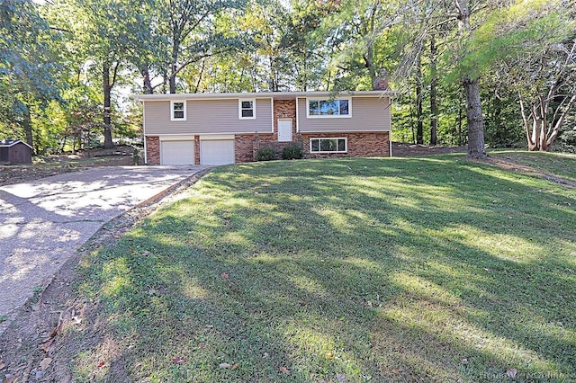 bi-level home featuring a front yard and a garage