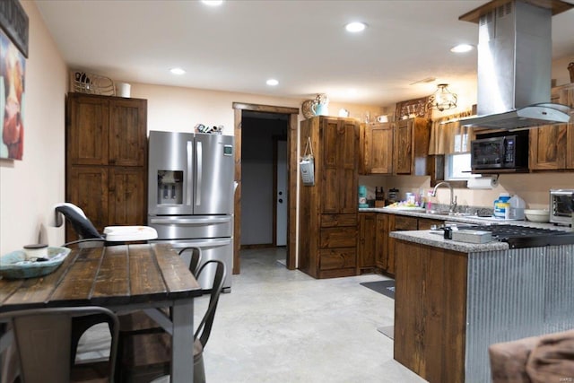 kitchen with sink, stainless steel fridge, and island range hood